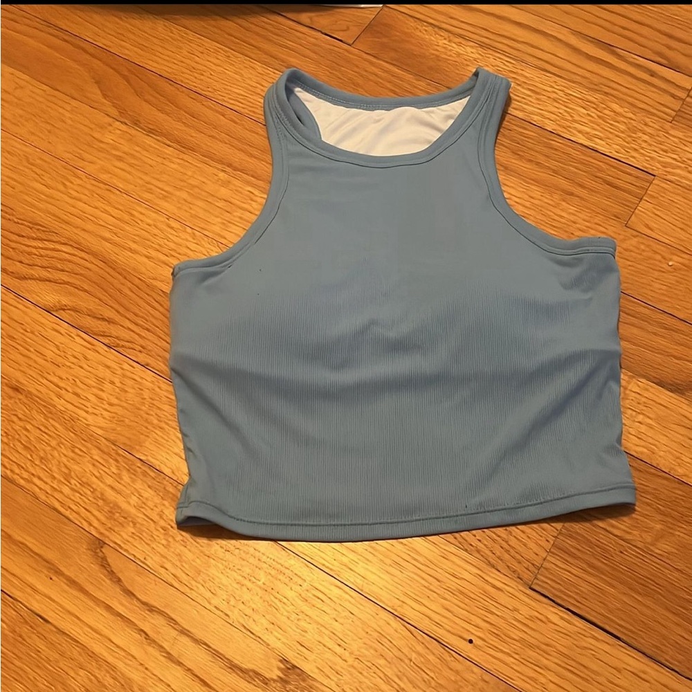 Swim suit like material, built in bra. Size small!!